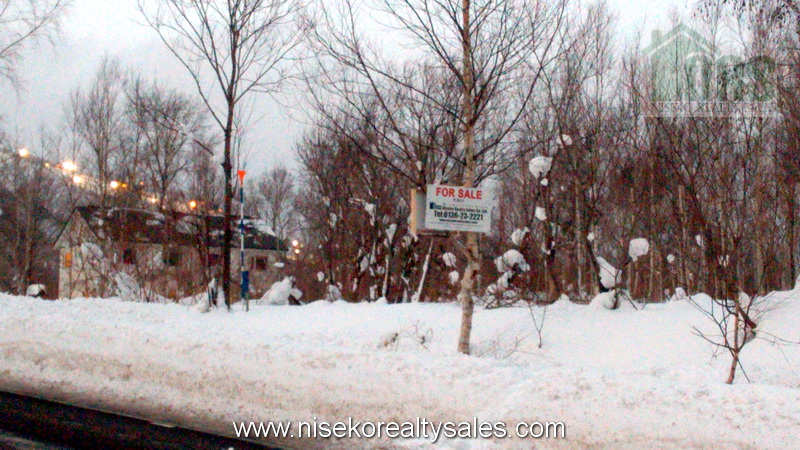 Looking northerly into the block. Niseko Grande Hirafu Night skiing lights seen in the background.